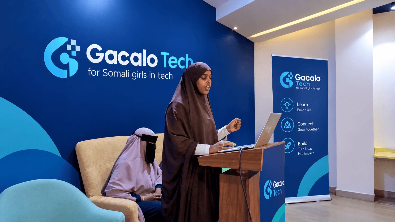 GacaloTech members presenting at a program